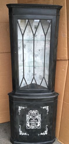 an old fashioned black grandfather clock on display