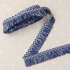 a blue and white tie laying on top of a table