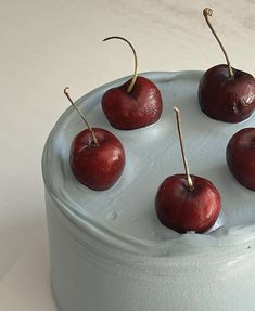 there are six cherries on top of the cake