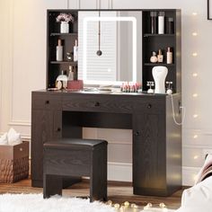 a bedroom with a vanity, stool and mirror on it's side in front of a christmas tree