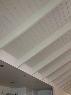 the ceiling in this kitchen is painted white