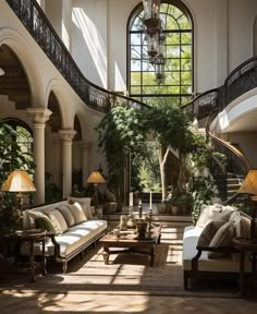 a living room filled with furniture and lots of windows