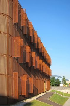 a tall building with lots of wooden slats on it's sides