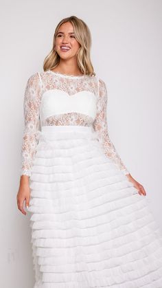 Experience the magic and allure of our Olivia Layered White Lace Tulle Dress, where timeless elegance meets modern romance. Whether you're walking down the aisle, attending a formal event, or celebrating a special occasion, this dress will make you feel like the epitome of grace and beauty. 78747 D8-2 Lace Bodice Fitted Dress For Prom Season, Prom Season Dresses With Fitted Lace Bodice, Prom Season Dresses With Lace Bodice, Prom Dresses With Lace And Fitted Bodice, Long Sleeve Dress With Illusion Neckline And Fitted Bodice, Elegant Lace Dress With Sheer Bodice And Sweetheart Neckline, Lace Trim Fitted Bodice Dress For Prom Season, Bridesmaid Dress With Sheer Bodice Ball Gown, Bridesmaid Dresses With Sheer Bodice In Ball Gown Shape