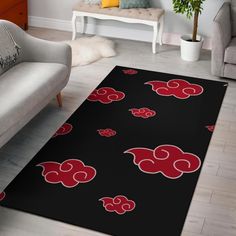 a black area rug with red clouds on it