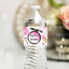 a bottle of water with a pink and black label on it that says sepia's free birthday