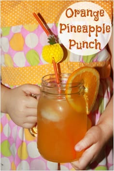 an orange pineapple punch in a mason jar