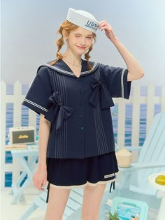 Get in touch with your inner playful and cute side with our charming dark blue short-sleeve shirt. This loose-fitting top features self-tie bowknots, sailor collar, and front button closure, adding an adorable touch to any outfit. Perfect for those who love the Lolita and kawaii fashion styles.  Please note that this product includes only the shirt.  Garment Size   	 		 			Size 			S 			M 			L 			XL 		 		 			Full Length 			60 			61 			62 			63 		 		 			Shoulders 			49 			51 			53 			55 		 		 			B Sailor Top Outfit, Sailor Shirt Outfit, Sailor Outfit Aesthetic, Sailor Outfit Mens, Sailor Inspired Outfit, Illit Concept, Sailor Outfit For Women, Sailor Collar Shirt, Sailor Collar Blouse