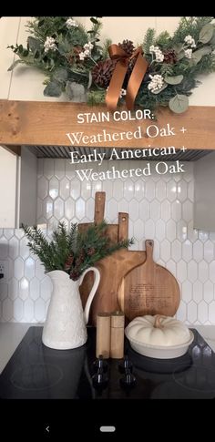 the kitchen counter is decorated for christmas with greenery and other holiday decorations on it