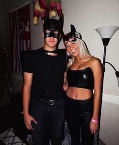 two people dressed up as batman and catwoman