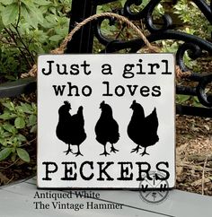 a sign that says just a girl who loves peckers on the side of a bench