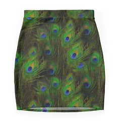 a green skirt with peacock feathers on it