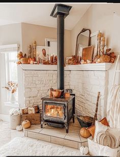 a wood stove sitting in the middle of a living room