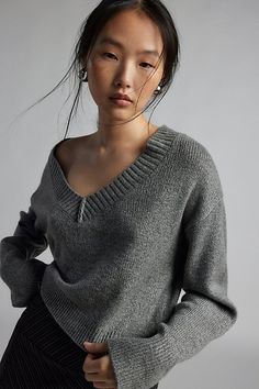 Forever staple BDG sweater in an effortless pullover sweater style. Designed in a boxy & cropped fit featuring a wide v-neckline and drop shoulders for a slouchy look. Finished with ribbed knit trim. Find it only at Urban Outfitters. Features BDG Jenna cropped v-neck sweater Slouchy oversized sweater Soft and stretchy knit Wide v-neckline and long sleeves with ribbed knit trim Ribbed knit hem Boxy, relaxed fit Cropped length Easy pullover style UO exclusive Contents + Care 53% Recycled polyester Star Headband, Slouchy Sweater, Leather Trench Coat, Shearling Coat, Velvet Tops, Pullover Jacket, V Neck Sweater, Her Style, Vneck Sweater