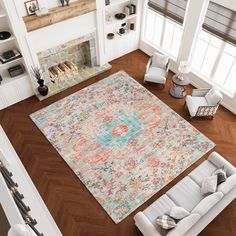 an aerial view of a living room with a large rug on the floor and fireplace