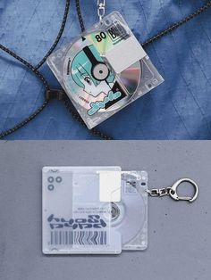 there is a cd and a keychain attached to the back of a bag