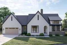 a white house with black roof and two car garages on the side of it