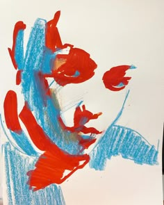 a painting with red, white and blue colors on it's face is shown