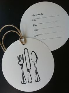 two tags with forks and spoons drawn on them