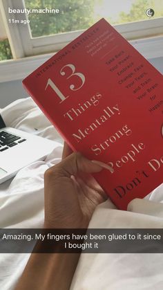 someone is reading a book on their bed with the caption, 13 things mentally strong people don't do