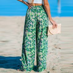 Add a pop of color to your wardrobe with the Green and Pink Abstract Wide Leg Pants, featuring a playful abstract print and comfortable wide-leg silhouette for a chic and vibrant look. Infuse your summer wardrobe with a touch of playfulness and vacation charm by incorporating the Green and Pink Abstract Wide Leg Pants. Product code: CAA02D4C007RP Green Bottoms With Pockets For Beach Season, Patterned Beach Pants For Spring, Spring Beach Patterned Pants, Patterned Pants For Beach In Spring, Casual Spring Bottoms With Pattern Prints, Patterned Pants For Spring Beach Outings, Casual Green Printed Bottoms, Casual Green Printed Pants, Green Bottoms With Vibrant Print For Vacation