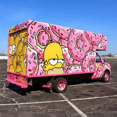 the simpsons truck is painted pink and has donuts on it