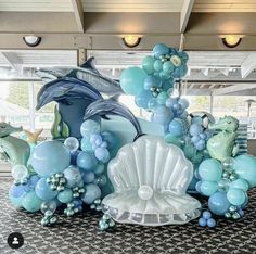 an ocean themed balloon sculpture with dolphins and other sea creatures