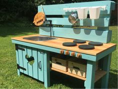 an outdoor kitchen made out of pallet wood