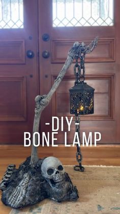 a skeleton lamp sitting on top of a wooden floor next to a door with the words diy bone lamp above it