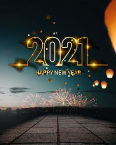 fireworks are lit up in the night sky next to a happy new year message with balloons