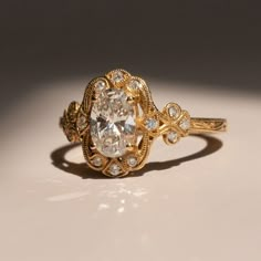 An undeniably beautiful ring inspired by the Victorian era.    Materials - 14k Yellow Gold, Lab-Grown Diamond (IGI Certified) Weights - 1.00ct lab grown Diamond, 0.14ct Melee Diamond Diamond Specs Cut - Oval Color - G Clarity - VS1 Dimensions - 8mm x 5mm x 3 Size - 6.5 Victorian Diamond Ring, Delicate Engagement Ring, New Victorian, Victorian Engagement Rings, Victorian Ring, Cute Engagement Rings, Future Engagement Rings, Art Deco Wedding Rings, Yellow Engagement Rings