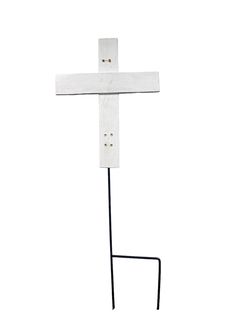 a wooden cross on a black stand against a white background