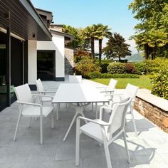 a white table and chairs on a patio