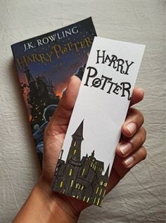 two harry potter books in their hands