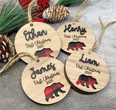 four personalized wooden christmas ornaments with bear designs