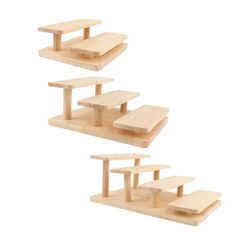 three pieces of wooden furniture are arranged in the shape of shelves