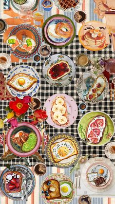 the table is set with many plates and bowls