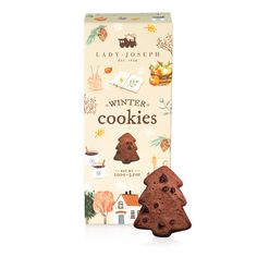 a box of winter cookies with an image of a house and tree on the front