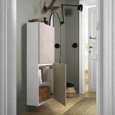 an open door leading to a bathroom with white walls