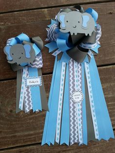 two blue and gray ribbons with elephants on them