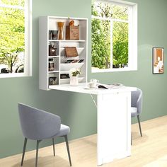 a room with green walls and white furniture