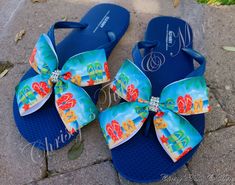 These Sandals are the most cute and fun addition to just about any outfit!    I am using durable, Old Navy brand Flip Flops for each ADULT pair. (WHOLE SIZES ONLY 5-10) These sandals feature a bright blue flip flop and a beautifully printed Beach scene with colorful flip flops sewn together in a ribbon bow with a true rhinestone strung, trimmed center.   Each bow is hand-sewn for the utmost support and also secured to each sandal with a combination of E6000 glue and strong, upholstery thread.  *IN THE PERSONALIZATION SECTION, PLEASE INCLUDE SHOE SIZE **Please remember that these are available in WHOLE SIZES only. If you are typically a half size, please consider SIZING UP as there will be NO RETURNS due to an improper or uncomfortable fit.   OTHER PATTERNS ARE AVAILABLE UPON REQUEST! Bow Flip Flops, Blue Flip Flops, Summer Flip Flops, Beach Flip Flops, Bow Shoes, Beach Scenes, Flip Flop Sandals, Mens Flip Flop, Ribbon Bows