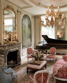 a living room filled with furniture and a grand piano