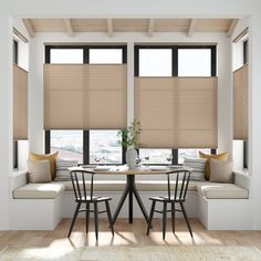 a dining room table with two chairs and a bench in front of the window that has blinds on it