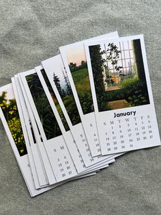 four calendars are stacked on top of each other in front of a gray background