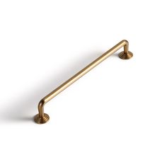 an antique brass pull handle on a white background