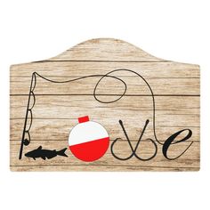 a wooden sign with the word love and fish on it, hanging from a hook