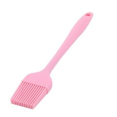 a pink comb on a white background