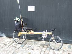 a bike parked next to a black wall