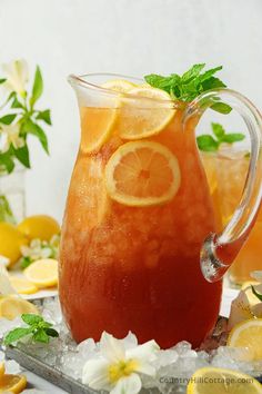 a pitcher filled with lemonade and garnished with mint